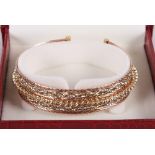 An Italian three-colour gold bracelet stamped 750, 21.2g gross