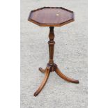 A walnut and box line inlaid octagonal top occasional table, on tripod splay supports, 14" wide