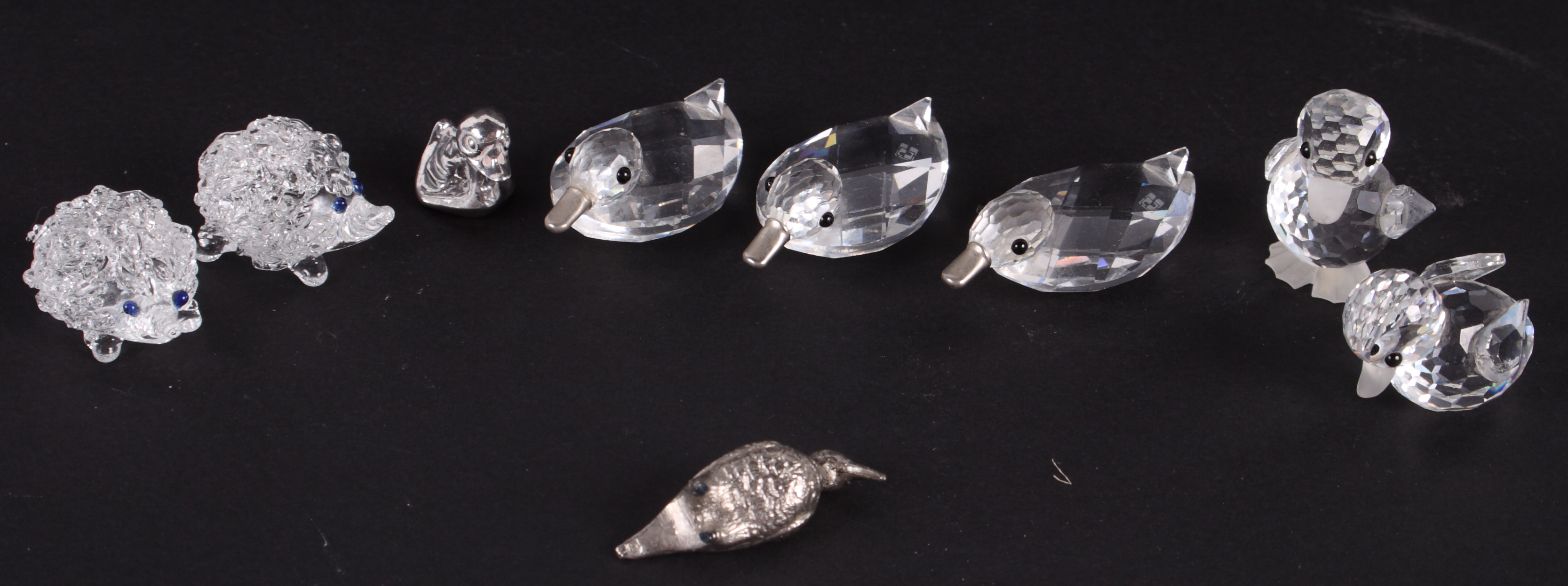 Three Swarovski crystal ducks, two similar chicks and other small ornamental items