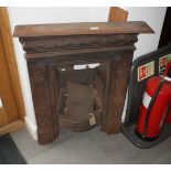 An early 20th Century cast iron bedroom fireplace