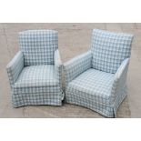 A pair of early 20th Century mahogany framed armchairs, upholstered in a checked fabric