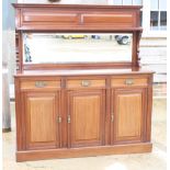 An early 20th Century mahogany sideboard, back fitted mirror and shelf, base fitted three drawers