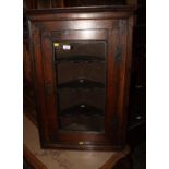 A late Georgian oak corner hanging cabinet enclosed glazed door, 20 1/2" wide