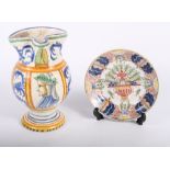 A Makkum faience saucer with traditional decoration, 6 1/2" dia, and an Italian majolica jug with