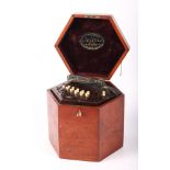 A 19th Century rosewood squeeze box by W Davis 50 Broad Street Bloomsbury London, with ivory keys,
