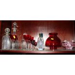 Three decanters and a small collection of coloured drinking glasses, etc