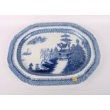 A 19th Century blue and white porcelain meat dish decorated proto Willow pattern, 20" wide