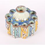 A majolica tulip holder decorated in blue and yellow glazes, 5" dia