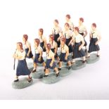 A group of thirteen Elastolin League of German Girls (Hitler Youth for Girls) moulded and painted