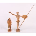 Three pairs of continental carved wooden figures of Don Quixote and Sancho Panza, largest 14" high