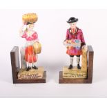 A pair of Wilkinson's pottery "Cries of London" figures mounted as bookends