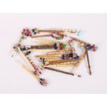 A collection of lace bobbins including bone and treen