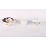 A Wedgwood part tea service decorated floral reserves on a blue and gilt ground and two other late