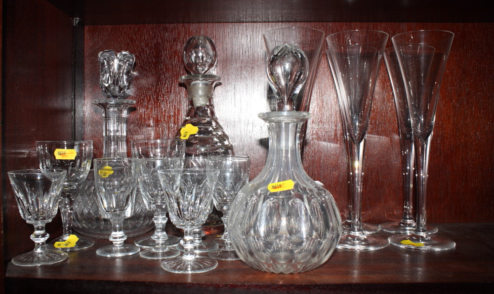 A set of six tall wines with drawn trumpet bowls, three decanters and a small collection of