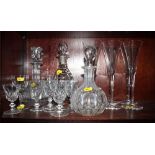 A set of six tall wines with drawn trumpet bowls, three decanters and a small collection of