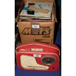 A collection of late 20th Century 45 rpm records and a Philips All Transistor radio