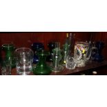 A pair of green glass candlesticks etched galleons, five coloured glass hyacinth vases and various