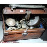 A copper kettle and a collection of assorted decorative brass items, in metal trunk