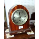 An early 20th Century mantel clock in lancet-shaped mahogany case, silvered dial