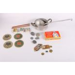 A Nazi aluminium saucepan, a companion ladle, five 1930s/1940s Nazi aluminium badges and assorted