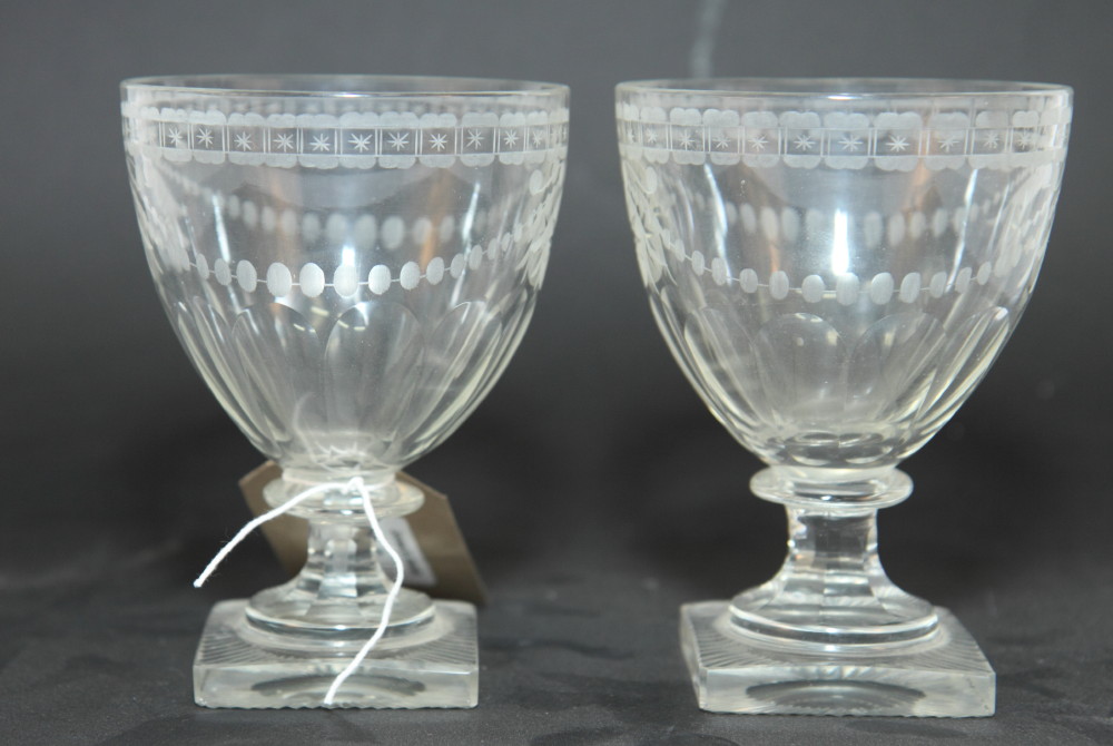 A pair of 19th Century glass rummers, bowls engraved swags, on square bases