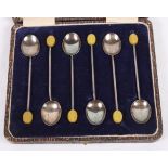 A set of six silver coffee spoons with bean finials, in case