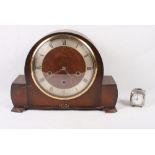 A 1930s oak cased mantel clock and a white metal cased travel alarm clock