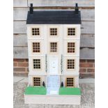 A doll's house modelled as a Georgian four-storey town house, 24" wide x 42" high, and a quantity of