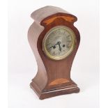 An Edwardian mahogany and satinwood inlaid shape top mantel clock with silvered dial and eight-day