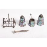 A silver four-division toast rack, an engine turned silver cigar piercer and a sterling silver and