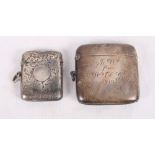 A plain silver vesta case with inscription dated 1913 and another vesta case engraved foliate