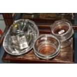 A silver plated and engraved pierced oval fruit basket, a plated biscuit box and cover, a pair of