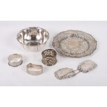 A pierced silver stand, 3oz troy approx, an embossed silver bonbon dish, 3.2oz troy approx, three