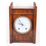 An Aesthetic style oak cased mantel clock, blue and white ceramic dial, 13" high