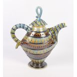 A Devon stoneware geometric teapot and cover (damages to cover) and a Moss Pottery tureen and