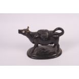 A 19th Century black glazed cow creamer, 6 1/2" long, and a studio pottery bread crock