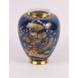 A Carlton oviform vase decorated oriental landscapes on a blue ground, 12" high, and six similar