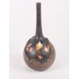 A Bretby bronzed finish bottle-shaped vase decorated bird and blossom, 13" high