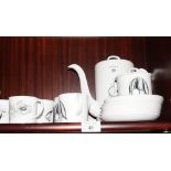 A Susie Cooper bone china black fruit decorated part coffee set for six