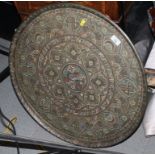 An Islamic engraved and enamelled circular brass tray, 25" dia