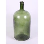 An early 19th Century green glass bottle, 14 1/2" high