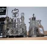 A Georgian silver four-bottle cruet stand (bottles a/f) together with a silver plated six-bottle