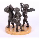 An early 19th Century bronze figure group of three putti playing musical instruments, on a Sienna