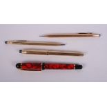 A Cross 14ct filled gold propelling pencil, a similar Cross 10ct rolled gold biro, a Cross 10ct