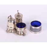 A silver three-piece cruet set and stand together with a pierced silver salt