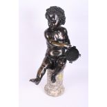 A late 19th Century bronze figure of a seated putto with a tambourine on marble base, 21" high