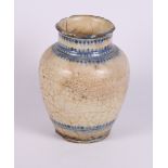 An early Middle Eastern crackle glazed jar, 8" high