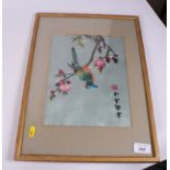 A set of three Chinese silk embroidered panels, in strip frames