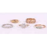 Three 18ct gold and gem set dress rings, a 9ct gold, diamond and ruby set dress ring and a white