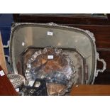 A large silver plated two-handled tea tray, an Art Deco silver plated tea tray and two plated